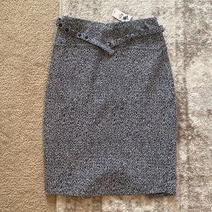 Express black abs white pencil skirt with belt and zip closure in back.